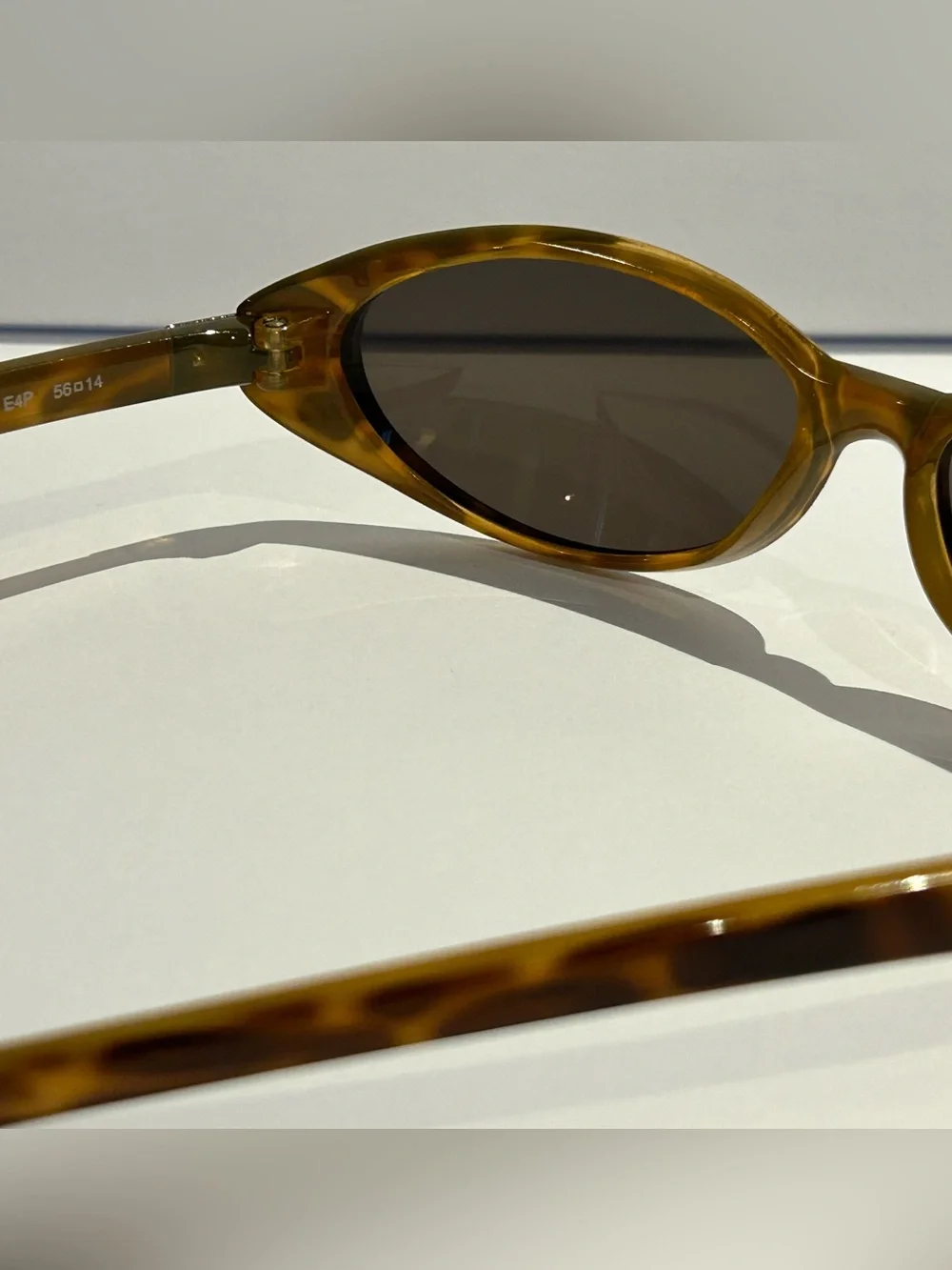 Gucci Tortoiseshell Oval Sunglasses with Brown Lenses